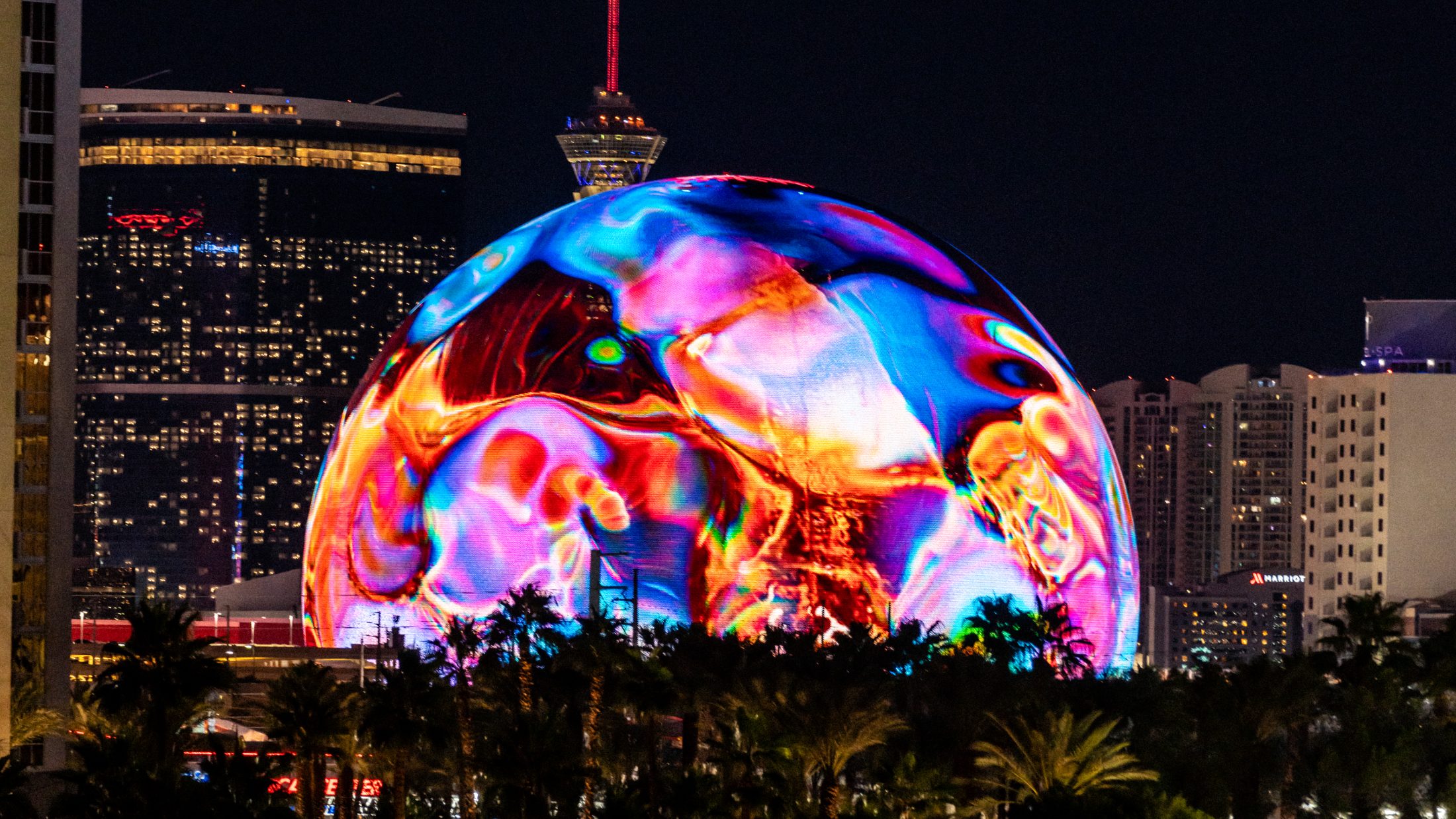 Coca-Cola Y3000 iridescent fluid simulation wrapping the Sphere in Las Vegas